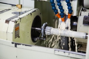 Picture of a machinery lathe producing a new part